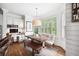Cozy dining area with shiplap walls, built-in desk, and a farmhouse-style table and benches at 1235 Grand View Se Dr, Smyrna, GA 30126