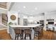 Bright, open kitchen featuring white cabinetry, granite countertops, breakfast bar, and stainless appliances at 1235 Grand View Se Dr, Smyrna, GA 30126
