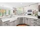 Updated gourmet kitchen with a farmhouse sink, stainless steel dishwasher, and ample countertop space at 1235 Grand View Se Dr, Smyrna, GA 30126