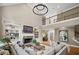 Open living room features soaring ceilings, custom built-ins, stone fireplace and hardwood flooring at 1235 Grand View Se Dr, Smyrna, GA 30126