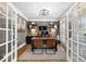 Home office with french doors, custom built-in shelving, and a work area for two people at 1235 Grand View Se Dr, Smyrna, GA 30126