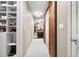 Custom walk-in closet with wood sliding doors and plenty of shelving at 1235 Grand View Se Dr, Smyrna, GA 30126