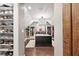 Spacious walk-in closet with custom island, wood floors and beautiful lighting at 1235 Grand View Se Dr, Smyrna, GA 30126