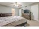 Bedroom with bed, ceiling fan, dresser and bathroom view at 2015 Wingate Way, Atlanta, GA 30350