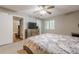 Spacious bedroom with neutral walls, fan, and modern furnishings at 2015 Wingate Way, Atlanta, GA 30350
