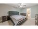 Bedroom featuring a bed with headboard, ceiling fan, and furnishings at 2015 Wingate Way, Atlanta, GA 30350