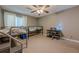 Neutral bedroom featuring a bunk bed, desk, and ceiling fan at 2015 Wingate Way, Atlanta, GA 30350
