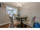 Cozy dining area with hardwood floors and modern decor open to kitchen at 2015 Wingate Way, Atlanta, GA 30350