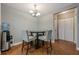 Dining area features a modern chandelier, seating for four, and ample natural light at 2015 Wingate Way, Atlanta, GA 30350