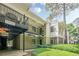 Close-up showing the condo's entry, covered parking and porch at 2015 Wingate Way, Atlanta, GA 30350