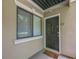Exterior shot of the condo's front door showing a welcome mat at 2015 Wingate Way, Atlanta, GA 30350