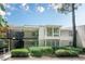 Charming condo with white siding, a balcony, and lush landscaping at 2015 Wingate Way, Atlanta, GA 30350