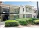 Charming condo with white siding, a balcony, and lush landscaping at 2015 Wingate Way, Atlanta, GA 30350