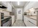 Bright kitchen with white cabinets, stainless steel refrigerator, and subway tile backsplash at 2015 Wingate Way, Atlanta, GA 30350