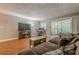 Cozy living room featuring hardwood floors, neutral paint, and sliding glass doors to the outdoor patio at 2015 Wingate Way, Atlanta, GA 30350