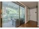 Relaxing screened-in patio with tiled flooring and views of the lush greenery and nearby landscape at 2015 Wingate Way, Atlanta, GA 30350