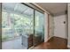 Relaxing screened-in patio with tiled flooring and views of the lush greenery and nearby landscape at 2015 Wingate Way, Atlanta, GA 30350