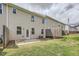 Backyard featuring a grassy area, wooded fence and concrete patio at 3070 Fareed St, Douglasville, GA 30135