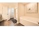 Luxurious bathroom showcasing a separate tub and shower, designed for relaxation and convenience at 3070 Fareed St, Douglasville, GA 30135