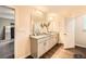 Elegant bathroom boasting dual sinks, granite countertops, and modern fixtures for a spa-like experience at 3070 Fareed St, Douglasville, GA 30135