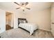 Bedroom with a ceiling fan, carpeted floor, and closet space at 3070 Fareed St, Douglasville, GA 30135