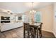 Dining area with hardwood floors, and an open view of the living room at 3070 Fareed St, Douglasville, GA 30135