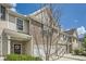 View of townhome exterior with brick and siding, front lawn, and a driveway at 3070 Fareed St, Douglasville, GA 30135