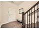 Foyer with hardwood floors, wooden staircase, and a view of the front door and mirror at 3070 Fareed St, Douglasville, GA 30135