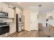 Modern kitchen with stainless steel appliances, granite countertops, and ample cabinet space at 3070 Fareed St, Douglasville, GA 30135