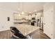 Kitchen island with granite countertops, pendant lighting, and modern appliances at 3070 Fareed St, Douglasville, GA 30135