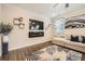 View of the living room with a modern electric fireplace and a decorative rug at 3070 Fareed St, Douglasville, GA 30135