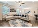 Open-concept living room with hardwood floors, modern decor, and natural light at 3070 Fareed St, Douglasville, GA 30135