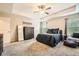 Comfortable main bedroom featuring soft carpet, neutral tones, a trey ceiling, and ample natural light at 3070 Fareed St, Douglasville, GA 30135