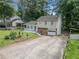 Lovely home with stone accents and a well-manicured lawn, complemented by a private driveway and mature landscaping at 3227 Fescue Cir, Lawrenceville, GA 30044