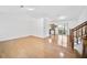 Bright, open-concept living area with hardwood flooring and a seamless transition to a modern kitchen with wood cabinetry at 3227 Fescue Cir, Lawrenceville, GA 30044