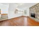 Living room featuring hardwood floors and a stone fireplace at 3227 Fescue Cir, Lawrenceville, GA 30044