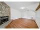 Spacious living room features a stone fireplace and hardwood floors at 3227 Fescue Cir, Lawrenceville, GA 30044
