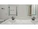 Bathroom featuring a double vanity with marble countertops and modern mirrors at 3649 Peachtree Ne Rd # 305, Atlanta, GA 30319