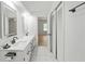 Bathroom features double sinks, marble counters and floors, and modern lighting at 3649 Peachtree Ne Rd # 305, Atlanta, GA 30319