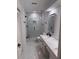 Modern bathroom with glass enclosed shower and dual sinks at 3649 Peachtree Ne Rd # 305, Atlanta, GA 30319