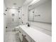 Modern bathroom with white cabinets, a white tiled shower and sleek black hardware at 3649 Peachtree Ne Rd # 305, Atlanta, GA 30319