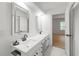 Bathroom features double sinks, marble counters and floors, and modern lighting at 3649 Peachtree Ne Rd # 305, Atlanta, GA 30319