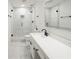 Modern bathroom with a glass enclosed shower, white tile and long vanity at 3649 Peachtree Ne Rd # 305, Atlanta, GA 30319