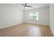 Well-lit bedroom with hardwood floors and ceiling fan at 3649 Peachtree Ne Rd # 305, Atlanta, GA 30319