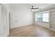 Bedroom featuring hardwood floors, shelving, and a ceiling fan at 3649 Peachtree Ne Rd # 305, Atlanta, GA 30319