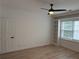 Bedroom featuring a ceiling fan, built-in shelving, and a window at 3649 Peachtree Ne Rd # 305, Atlanta, GA 30319