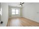 Bedroom features hardwood floors, a ceiling fan and a built-in bookcase at 3649 Peachtree Ne Rd # 305, Atlanta, GA 30319