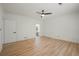 Spacious bedroom with hardwood flooring, ceiling fan, and access to bathroom at 3649 Peachtree Ne Rd # 305, Atlanta, GA 30319