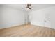 Spacious bedroom with a ceiling fan, light wood floors, and a walk-in closet door at 3649 Peachtree Ne Rd # 305, Atlanta, GA 30319