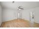 Spacious bedroom with hardwood flooring, ceiling fan, and ensuite bathroom at 3649 Peachtree Ne Rd # 305, Atlanta, GA 30319